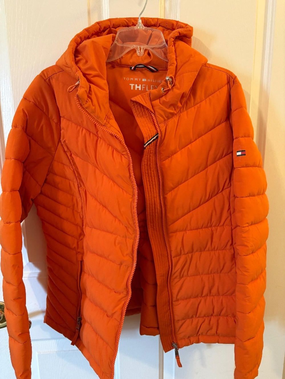 Woman’s Tommy Hilfiger puffer jacket with hood Size Large color orange